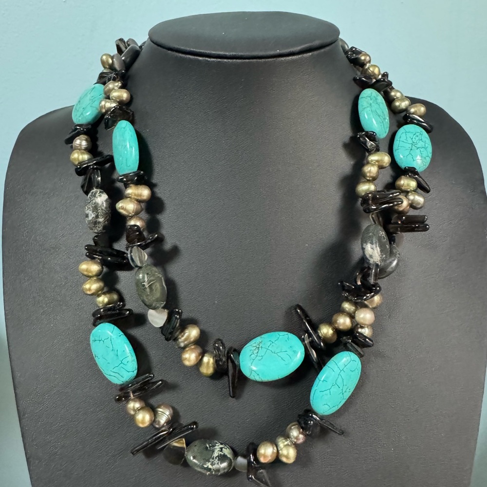 Multistrand necklace with green/gold cultured pearls and stones